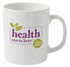 A plain white ceramic mug with a logo and text featuring green leaves and purple lettering.