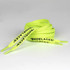 A pair of bright neon yellow shoelaces with printed text along the length.