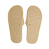 A pair of tan PU debossed slides with a pebble-styled sole and textured grip. Features a logo on the sole.