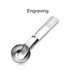 A stainless steel ice cream scoop with a shallow bowl and a smooth handle, featuring a logo.