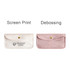 A velvet glasses pouch in light pink and white, featuring a logo and a clasp closure.