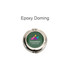 A round silver compact mirror with a green epoxy domed lid featuring a multicoloured logo and branding.