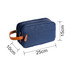 A navy toiletry bag with a brown leather handle, featuring two zipper compartments and rectangular shape.