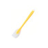 A silicone spatula with a yellow handle and a white spatula head. It features a hole for hanging.