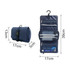 A navy blue folding travel toiletry bag, featuring compartments, a hook, and dimensions displayed for reference.