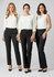 Three models wearing black slacks, styled with various white tops and showcasing a sleek, professional look.