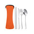 An orange pouch containing silver cutlery: a knife, fork, spoon, and chopsticks.