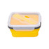 A yellow reusable silicone food storage container with a clear lid and integrated utensils. It has a sleek design and a logo.