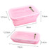 A collapsible silicone food storage container in pink with measurements displayed. It has a logo on the lid.