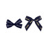 Two adhesive bows in dark blue, featuring text patterns in gold. One bow is larger and the other smaller.