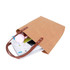 A brown washable kraft paper bag with a PU handle, filled with assorted items, including a drink bottle and papers.