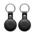 A black tracking tag with a keyring attachment, featuring a smooth circular design and a branding logo.