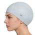A premium silicone swimming cap in light grey, featuring a textured surface and a logo on the side.