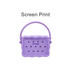 A silicone bag in lavender with a textured design and handle, featuring multiple holes for ventilation.