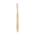 A large wavy handle toothbrush in a natural wood tone with white bristles and a simple design.