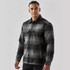 A men's black and grey plaid jacket with a Sherpa lining and button front, featuring two chest pockets and a logo.