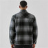 A plaid jacket with a Sherpa lining in shades of grey, featuring a collar and long sleeves. The back view is shown.