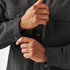A men's dark grey oxford canvas jacket with a sherpa lining and snap-button closures on the cuffs and chest pockets.