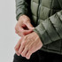 A Men's Tundra Thermal Jacket in olive green, featuring a puffer style and a close-up of the cuff detail.