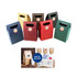 A selection of die cut handle bags in red, green, dark blue, and brown, featuring round labels and cut-out handles.