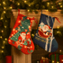 Two festive Christmas stockings hang by a decorated fireplace, one red with Santa and the other blue with a snowy scene.