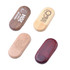 An assortment of oblong wooden flash drives in various finishes, featuring different engravings and a logo.
