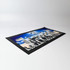 A bar runner featuring a black edge and a blue design with multiple images, and includes a logo.