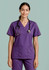 A purple women's scrub top with short sleeves and a V-neck, featuring pockets and a stethoscope.