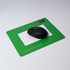 A green photo frame mouse mat featuring a black computer mouse on a smooth surface.
