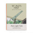 A green foldable camp light is displayed against a natural background, featuring a logo on the product.