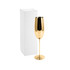 A stainless steel champagne flute in a shiny gold finish, next to a plain white box.