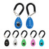 A training clicker in various colours including blue, black, white, green, and pink, with a coiled lanyard for attachment.