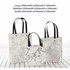 A set of three marble-patterned bags with black handles in varying sizes: large, medium, and small.
