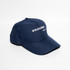A navy blue baseball cap with a curved brim and an adjustable strap at the back. It features a logo on the front.