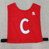 Red pull-over elastic netball bib featuring a prominent white 'C' and a logo. Ideal for sports uniforms.