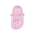 A pink classic clog shoe fridge magnet with ventilation holes and a strap. The image features a simple design and has a logo.