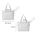 A lightweight grey tennis tote bag displayed with adjustable handles and two tennis racquets partially inserted.