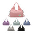 A pink duffle bag with a yoga mat strap, alongside options in lavender, grey, green, and black. The bag has a logo.