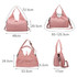 A pink duffle bag with a yoga mat strap, featuring adjustable shoulder straps and various dimensions. It has a logo.