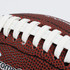 A mini promotional American football in red and white, featuring textured detailing and a logo.