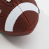 A mini promotional American football in red and black with white detailing and a logo.