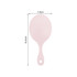 A handheld makeup mirror in a soft pink colour, with a smooth surface and a comfortable handle. It features a logo.