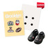 A pack of four custom shoe charms featuring sports designs, displayed alongside a pair of black shoes and a backing card.