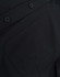 A close-up of a black cotton blend shirt featuring buttons and a pocket detail.