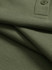 A close-up of an olive green ultrafine cotton pique polo shirt featuring a button and textured fabric.