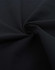 A close-up of black fabric in a swirling pattern, showcasing a soft texture ideal for apparel.