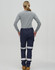 A pair of navy work pants with reflective tape, worn with a grey long-sleeve shirt, seen from the rear.