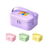 A portable mini suitcase in light purple with a handle, accompanied by pink, green, and yellow variants. Features a logo.