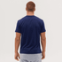 A navy blue T-shirt is displayed, featuring a plain back view and a fitted design. The model has short, brown hair.
