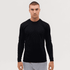 A long sleeve tee in black, featuring a fitted design and a logo, worn by a model against a plain background.